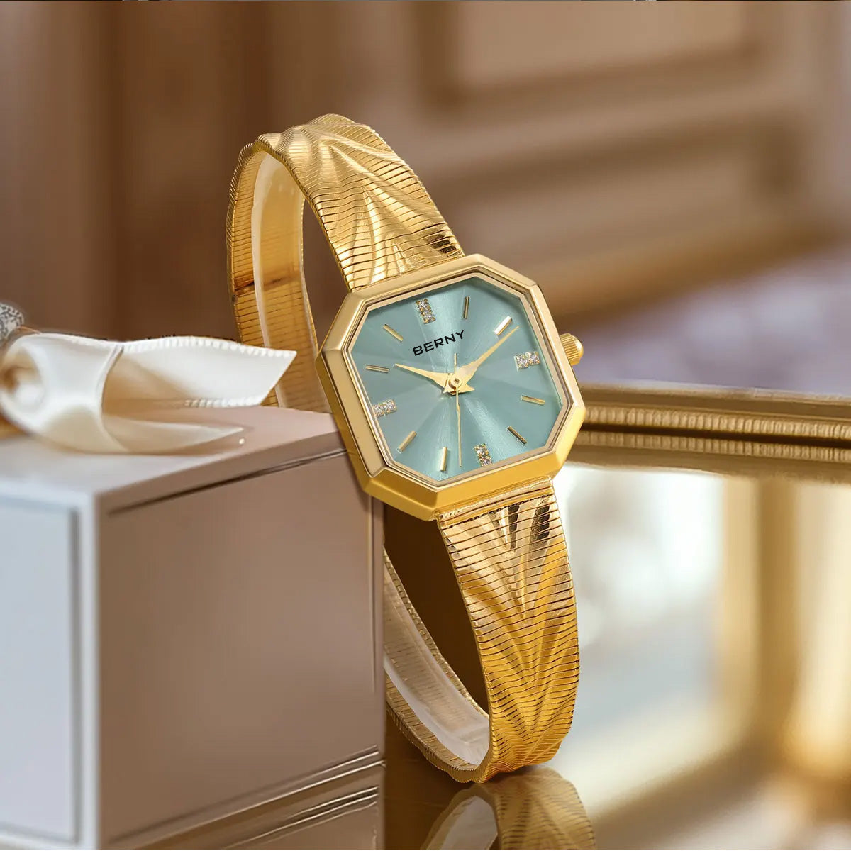 Light-blue BERNY octagonal watch with a gold-tone bracelet in a warm setting