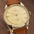 Gold-dial small-seconds watch close-up