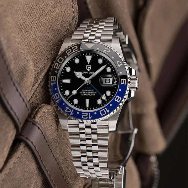 Black-and-blue GMT watch with five-link steel bracelet on its original fabric setting