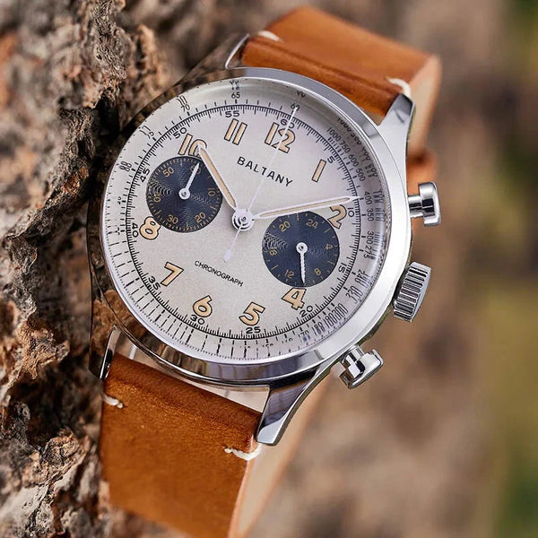 Baltany cream-dial chronograph with brown leather strap on natural bark